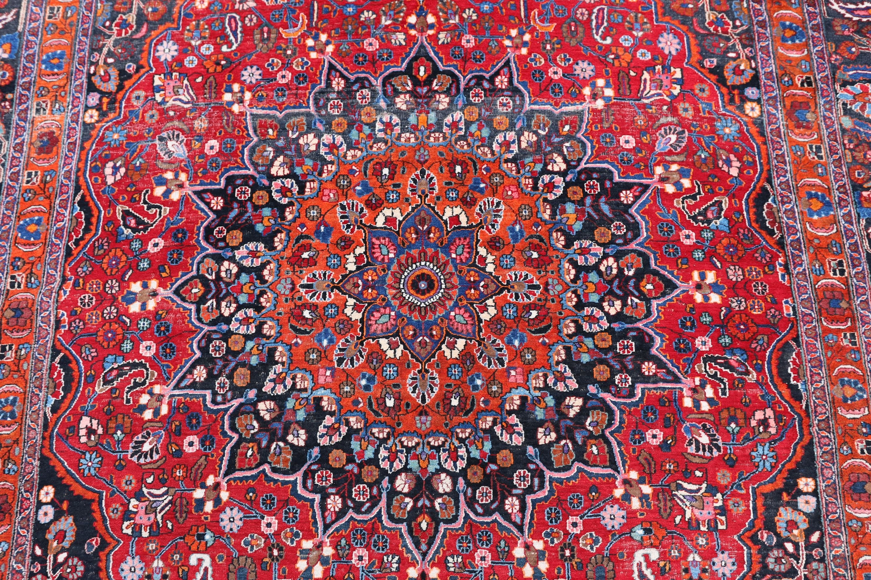 A Tabriz red ground carpet 422 x 326cm.